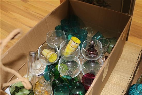 A collection of green and cranberry glassware